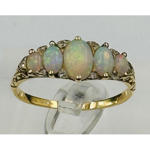 492 - An opal and diamond set ring, set with five oval cabochon cut opals, measuring between 7.4mm x 5.17m... 