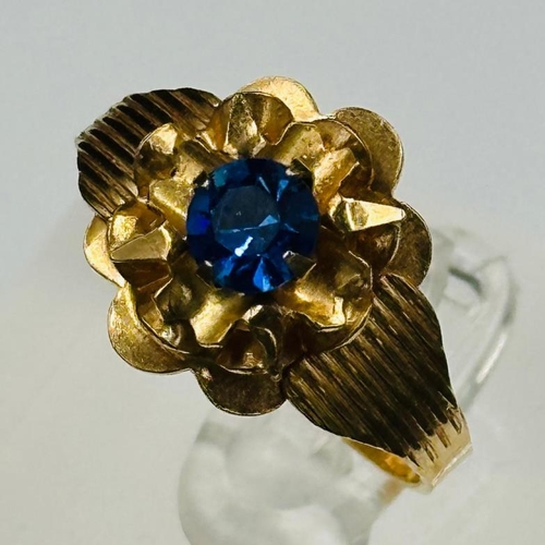 557 - An 18ct gold fancy blue stone ring , approximate weight 4g and size S