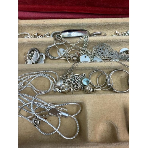 569 - A selection of silver jewellery to include, necklaces, rings, some amber etc.