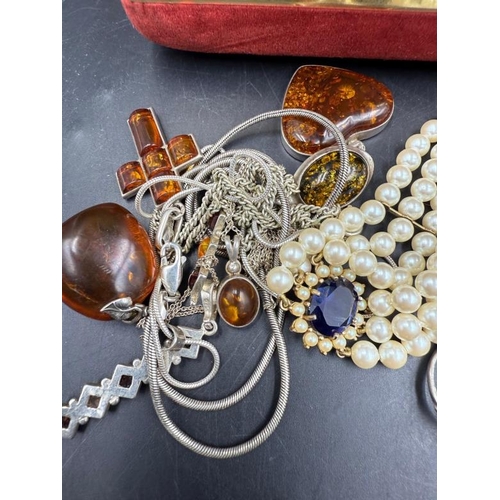 569 - A selection of silver jewellery to include, necklaces, rings, some amber etc.