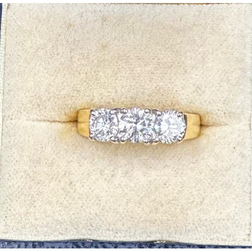 577 - A three stone diamond ring, mounted in 18ct yellow and white gold, London hallmarked, EF maker, cent... 