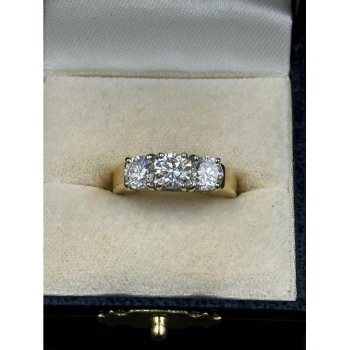 577 - A three stone diamond ring, mounted in 18ct yellow and white gold, London hallmarked, EF maker, cent... 