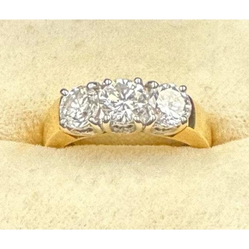 577 - A three stone diamond ring, mounted in 18ct yellow and white gold, London hallmarked, EF maker, cent... 