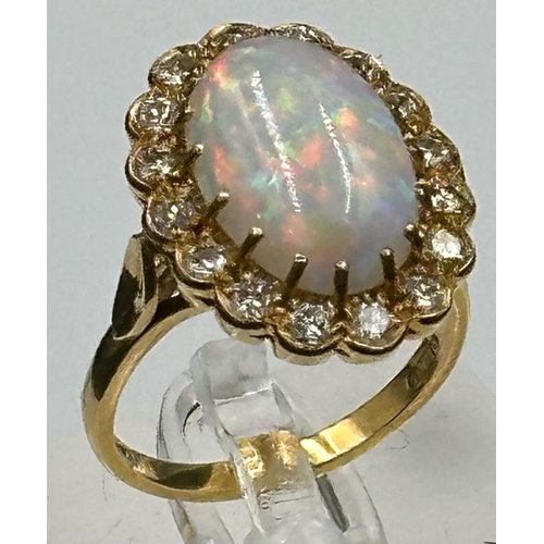 579 - An 18ct Opal and diamond ring, approximate size N 1/2