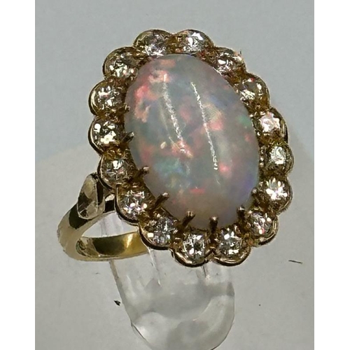 579 - An 18ct Opal and diamond ring, approximate size N 1/2