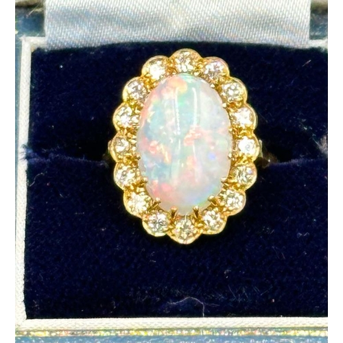 579 - An 18ct Opal and diamond ring, approximate size N 1/2