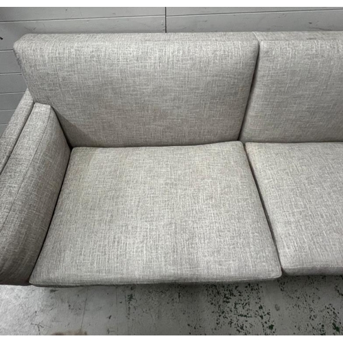 58 - Kingcome sofa, sharp outline with a linen style upholstery (H84cm W215cm D90cm)