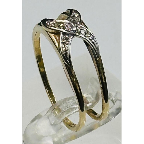 583 - A double crossover diamond ring, approximate weight 2.3g and size P