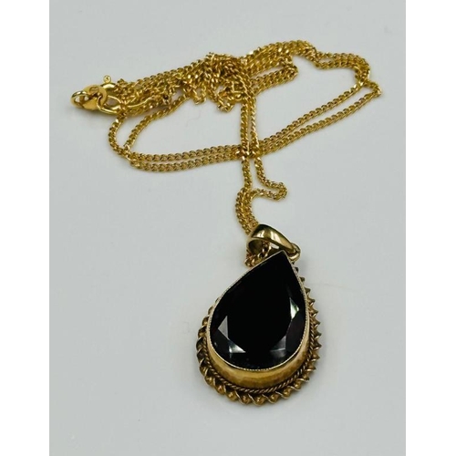 593 - A 9ct fine necklace with pear shaped pendant and approximate weight of 5.7g