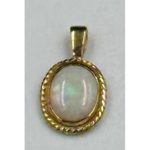 603 - A 9ct gold opal pendant