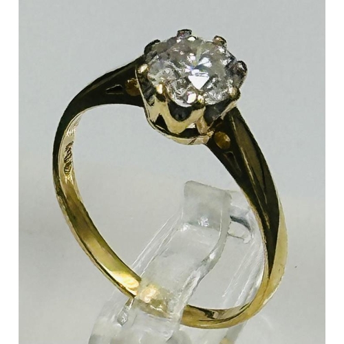 606 - A diamond ring on 18ct gold setting with approximate 1ct central diamond. Approximate size L and wei... 