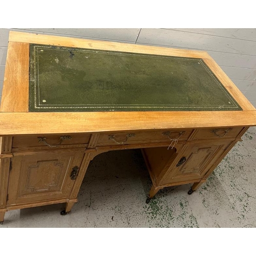 61 - A light oak desk with leather top (H77cm W166cm D60cm)