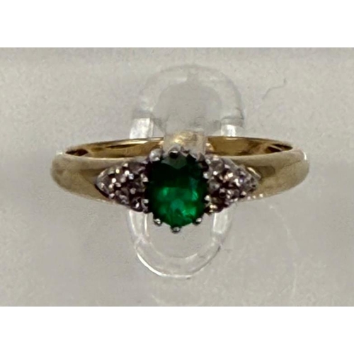 618 - A 9ct gold emerald and diamond style ring, approximate weight 2g and size N.