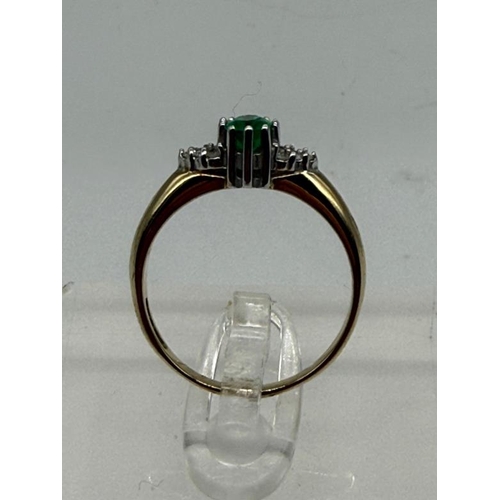 618 - A 9ct gold emerald and diamond style ring, approximate weight 2g and size N.