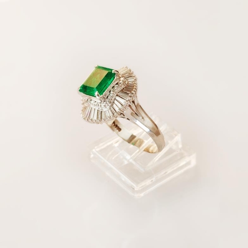 622 - An emerald and diamond ballerina style cluster ring, emerald cut emerald, approximately 2.25 carat, ... 