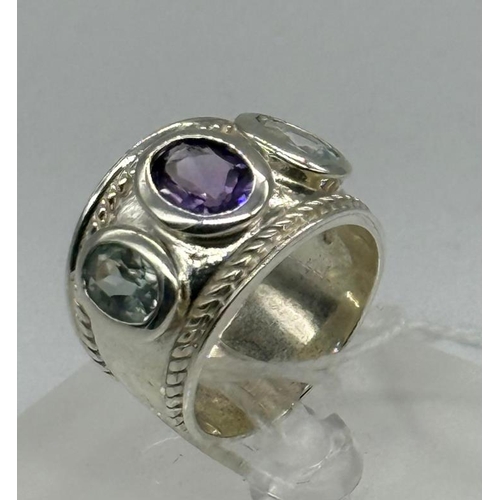 630 - Oval amethyst and aqua dress ring set with one oval amethyst 1.20ct and flanked by two oval aquamari... 