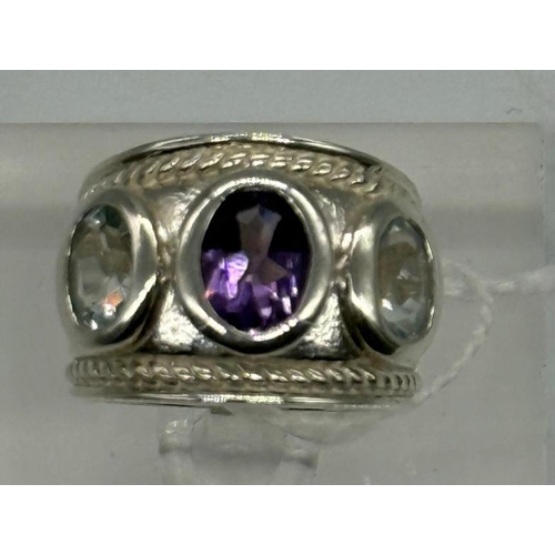 630 - Oval amethyst and aqua dress ring set with one oval amethyst 1.20ct and flanked by two oval aquamari... 