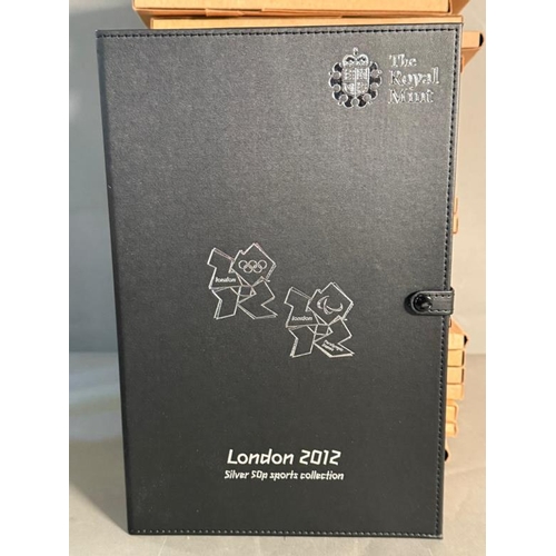 674 - Twenty nine Royal Mint Fifty pence coin collectors packs along with The London Olympics 1012 collect... 