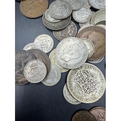 689 - A selection of George V and VI coinage to include pennies and shillings