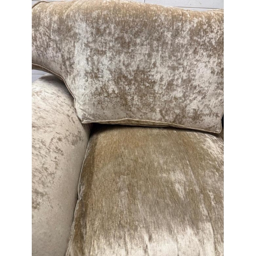 7 - A two seater fawn upholstered sofa