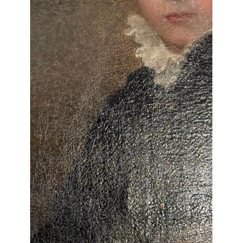 716 - An 18th Century oil painting of a young boy, seated. Frame size 63cm x 77cm.