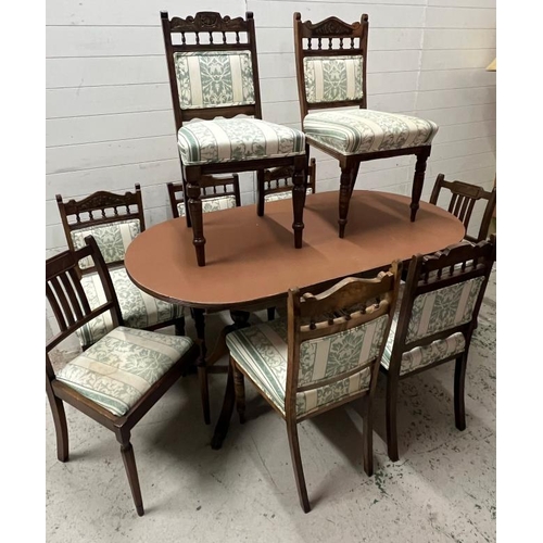 72 - A mahogany dining table with a set of chairs