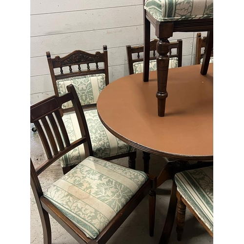 72 - A mahogany dining table with a set of chairs