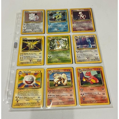 743 - A partial Pokemon Basic set 71/102 including 4 Holo cards