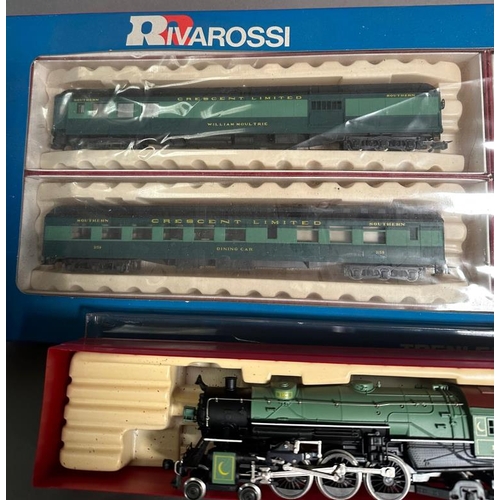 753 - A boxed Rivarossi steam engine and coal car and a box of four Rivarossi trains