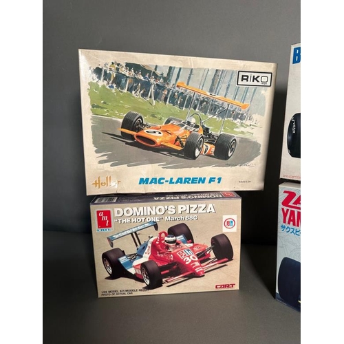 763 - Four vintage racing car model kits by Hasegawa, Riko and AMT