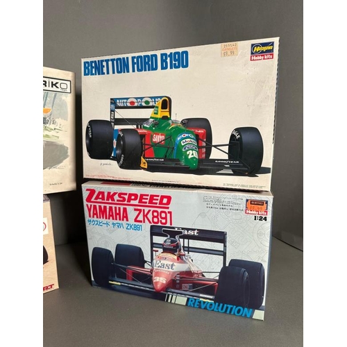 763 - Four vintage racing car model kits by Hasegawa, Riko and AMT