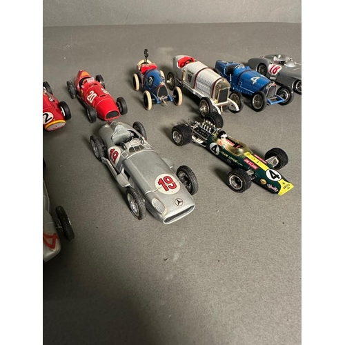 778 - A selection of Diecast racing cars to include Ferrari, Mercedes and Bugatti