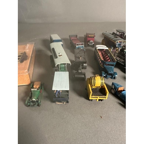 780 - A selection of play worn plastic and Diecast vehicles to include steam rotters, buses and carts