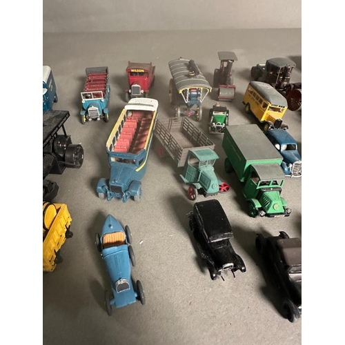 780 - A selection of play worn plastic and Diecast vehicles to include steam rotters, buses and carts