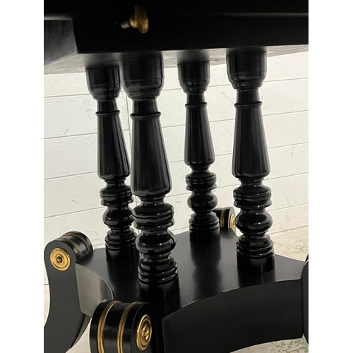 83 - Ebonised pedestal dining table with brass ornate decor  (H75cm Dia137cm)