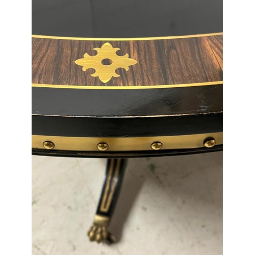 83 - Ebonised pedestal dining table with brass ornate decor  (H75cm Dia137cm)