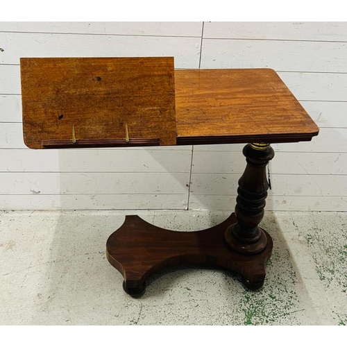 87 - A mahogany Revival twin reading table with a double book rest, adjustable turned stem on a solid bas... 