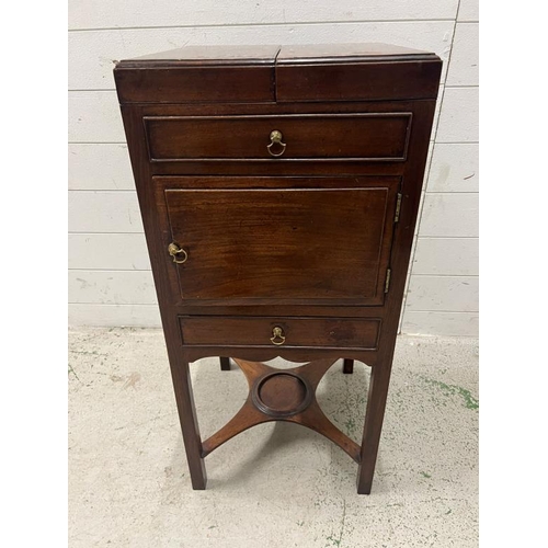 88 - A Georgian mahogany fold over top wash stand cupboard, standing on square section legs with the stre... 