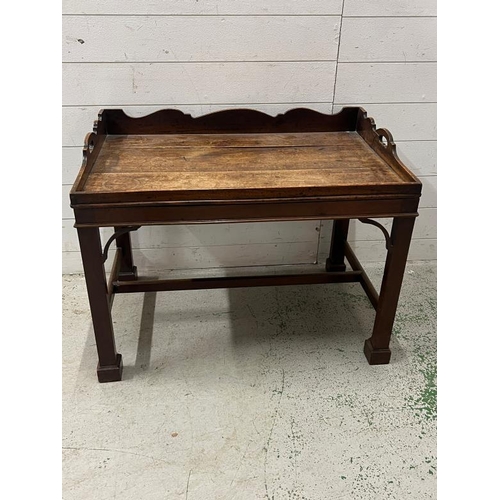 95 - A Georgian mahogany butlers tray on stand, gallery tray sits on square legs (H61cm W80cm D50cm)