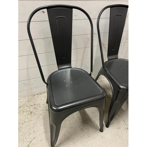 99 - Four Industrial style stackable metal chairs