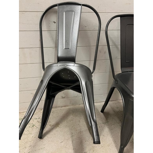 99 - Four Industrial style stackable metal chairs