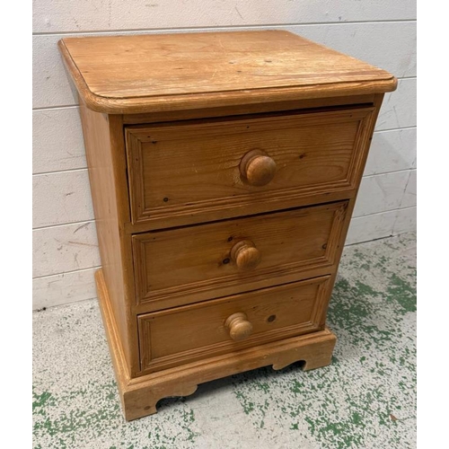 109 - A pine bedside with three drawers (H60cm W46cm D38cm)