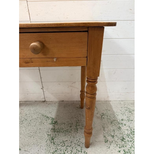 111 - Antique pine side table with two drawers to front (H73cm W92cm D52cm)