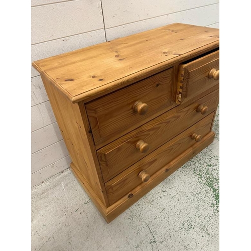 112 - Two over two pine chest of drawers (H69cm W85cm D39cm)