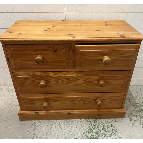 112 - Two over two pine chest of drawers (H69cm W85cm D39cm)