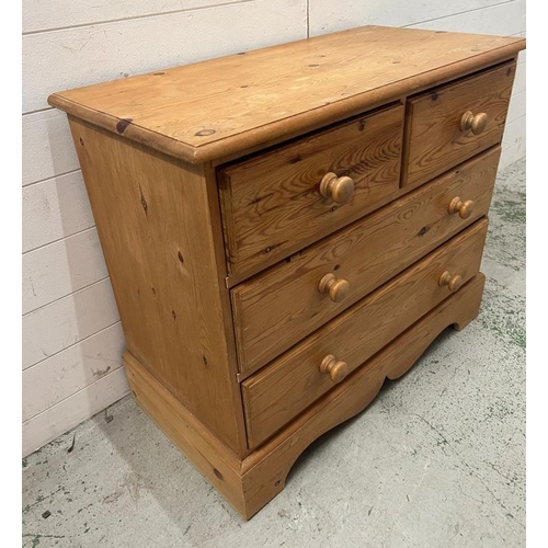 113 - Tow over two pine chest of drawers with a shaped bracket foot (H77cm W92cm D45cm)