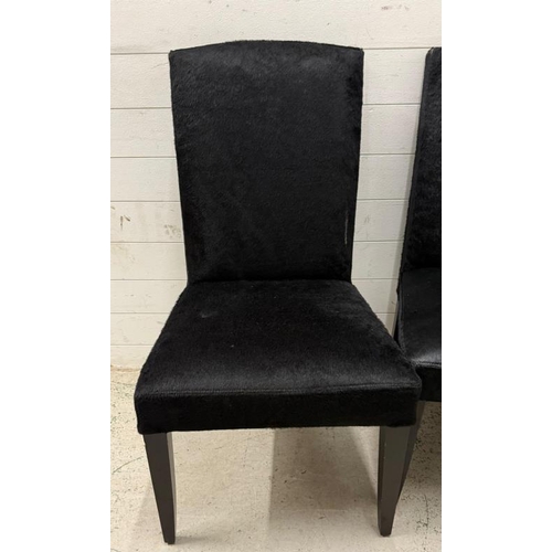 118 - Four contemporary dining chairs upholstered in black faux hide by Mode Nature