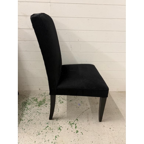 118 - Four contemporary dining chairs upholstered in black faux hide by Mode Nature