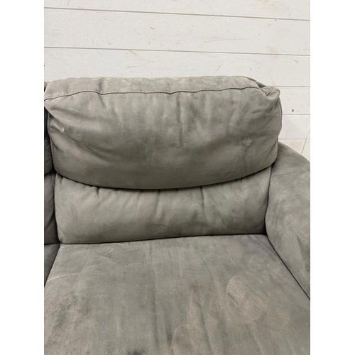 120 - A two seater electric reclining sofa upholstered in a grey suede on chrome legs