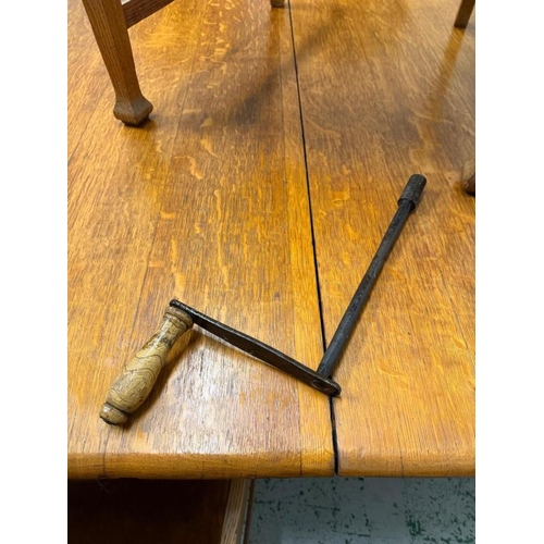 149 - A light oak extendable three leaf dining table on turned and fluted baluster legs and eight Arts and... 